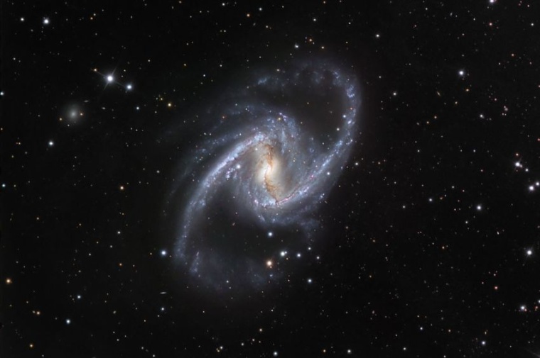 Die Spiralgalaxie NGC 1365 im sichtbaren Licht. (Bild: ESO/IDA/Danish 1.5 m/ R....